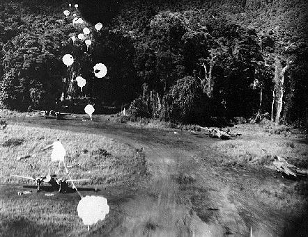 Allied parachutes over Japanese island