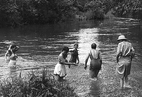 WWII WACS bathing in stream in Pacific Theater